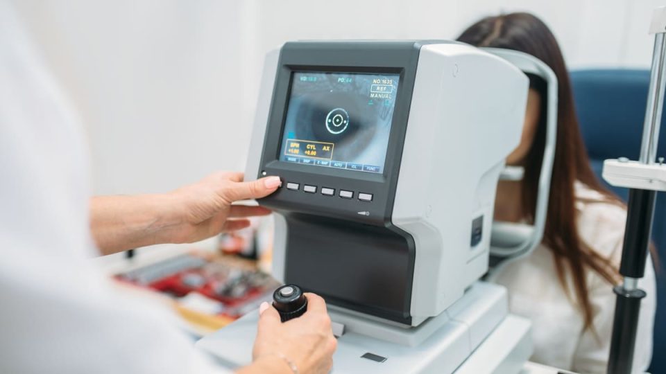 Computer diagnostics of vision, professional choice of glasses. Eyesight examination in optician cabinet